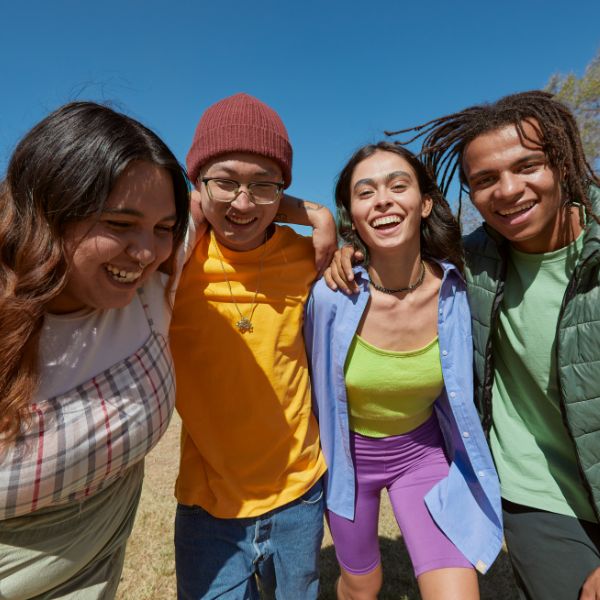 Diverse group of happy young people outdoors.